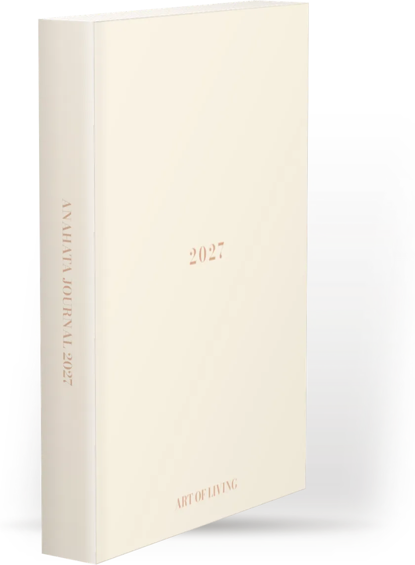 Anahata Journal 2027 seen at a three-quarter angle: the spine with ‘Anahata Journal 2027’ in gold lettering, running from top to bottom, and the cream cover with ‘2027’.